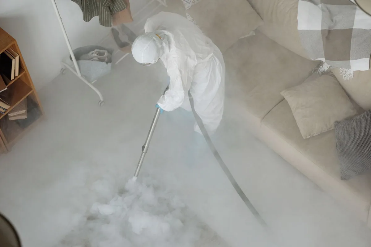 Biohazard cleanup technician in protective equipment, Los Banos, CA